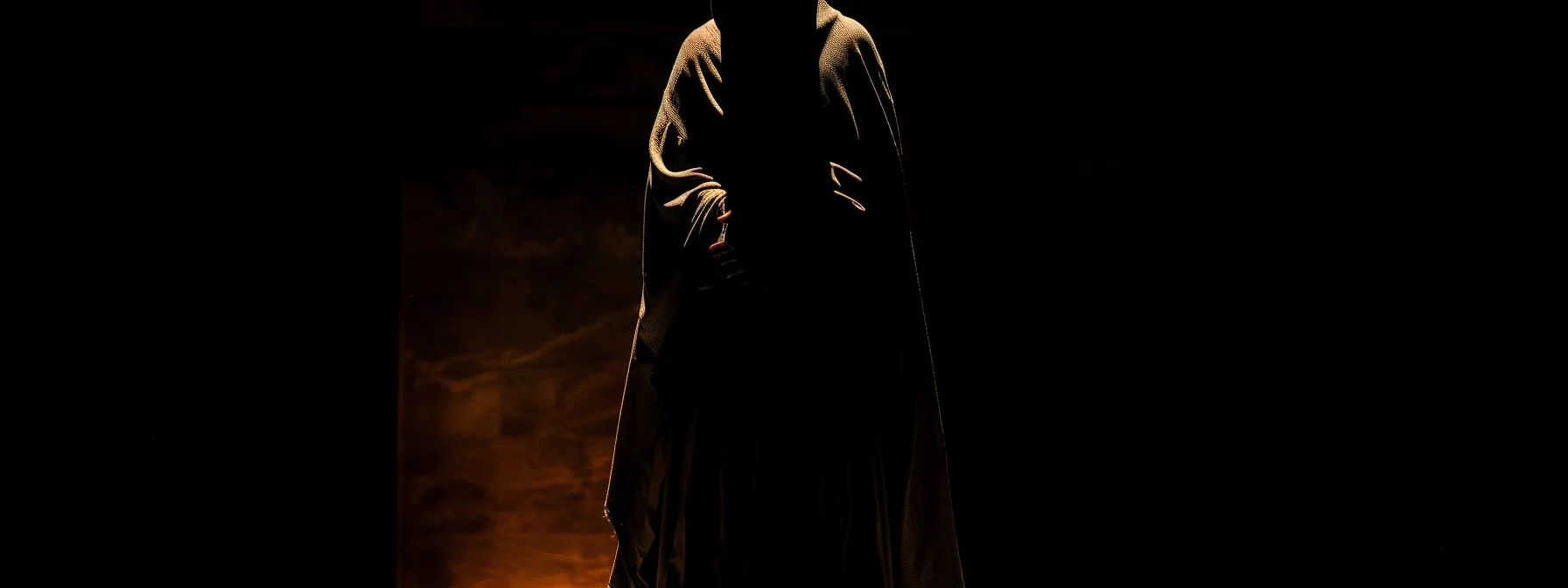 a dark, ominous figure cloaked in shadow, embodying the ancient symbol of the grim reaper. a dark, ominous figure cloaked in shadow, embodying the ancient symbol of the grim reaper.