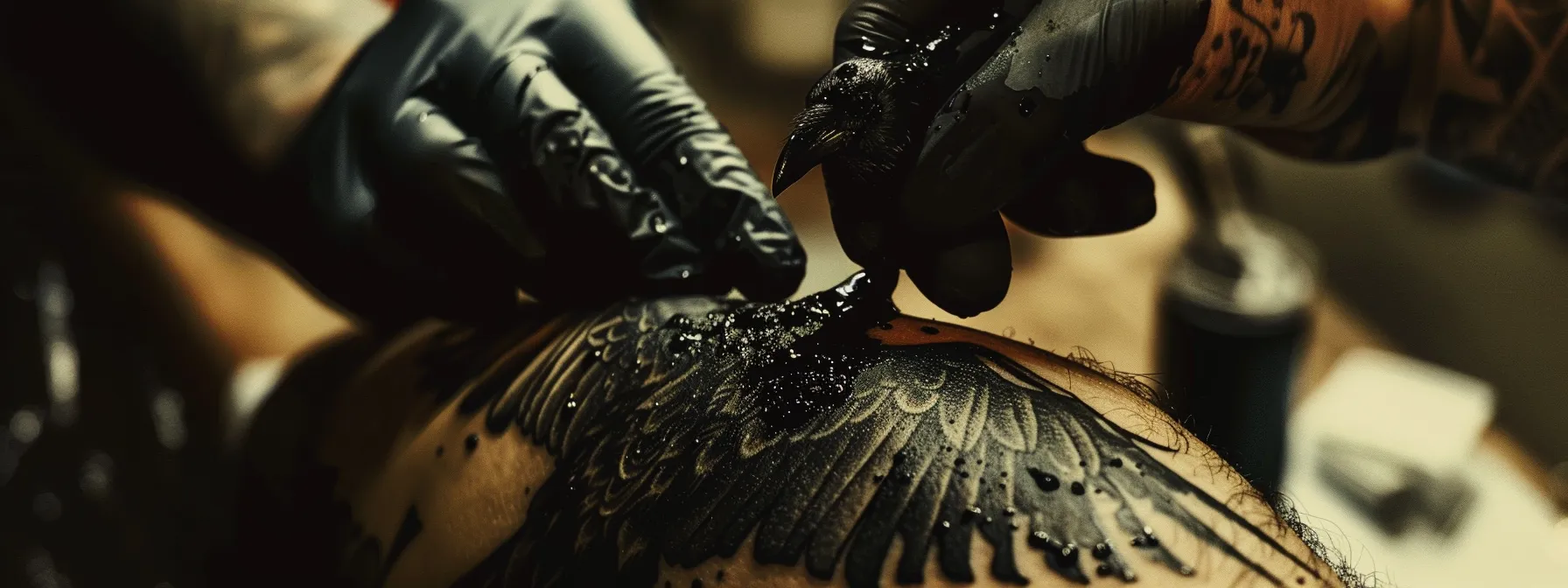 a striking black crow tattoo design being intricately inked onto someone's skin by a skilled artist, capturing both the intensity and artistry of the process. a striking black crow tattoo design being intricately inked onto someone's skin by a skilled artist, capturing both the intensity and artistry of the process.